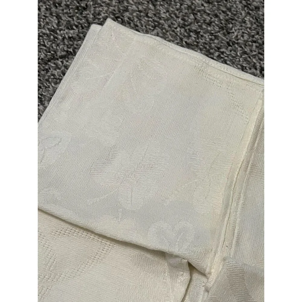 4 ivory damask dinner napkins with subtle leaf pattern